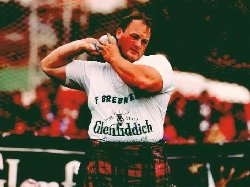 A "Heavy" athlete prepares to Putt the Shot at Dufftown Highland Games, Dufftown, Moray, Scotland, UK.
