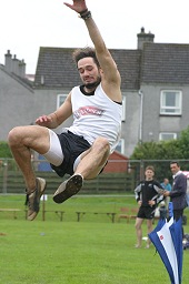 Andrew McDonald breaks the Long Jump record in 2007 at Dufftown Hughland Games, Dufftown, Moray, Scotland, UK.