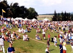 A family day out, some of the spectators enjoying Dufftown Highland Games, Dufftown, Moray, Scotland, UK.